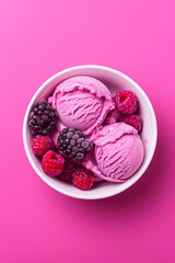 Top view of huckleberry ice cream scoops with berries