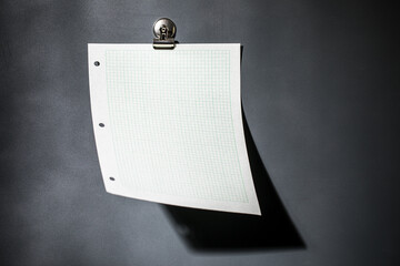 Green graph paper on dark gray magnet board