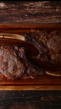 grilled tomahawk steak on cutting board