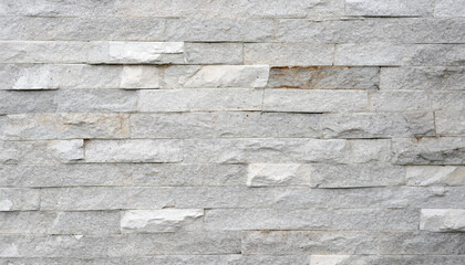 Stone wall texture background - grey stone siding with different sized stones