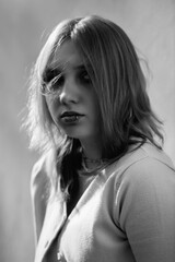 portrait of a young beautiful blonde girl in black and white style.