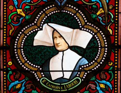 Our Lady of the Miraculous Medal. Stained glass window of Saint Catherine Labour&eacute; to whom the Virgin Mary appeared. Notre-Dame de la M&eacute;daille Miraculeuse. Vitrail de Sainte Catherine Labour&eacute;.