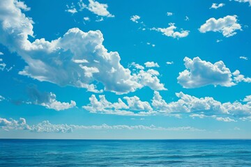 Obraz premium Beautiful blue sky with white clouds is reflecting in the calm sea on a bright sunny day