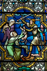 Fototapeta premium Stained glass window of King Solomon's Judgment (Just Judgment) and two women fighting over the same child. Scène biblique : Vitrail du Jugement du Roi Salomon (Jugement juste). 