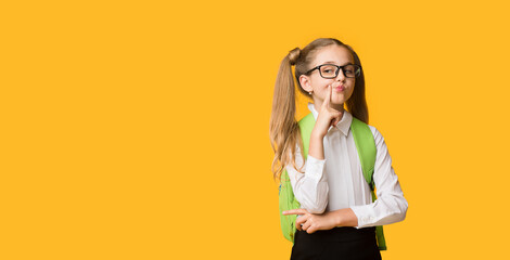 Funny Elementary Schoolgirl Posing Pretending Being Haughty On Yellow Background. Panorama, Free...