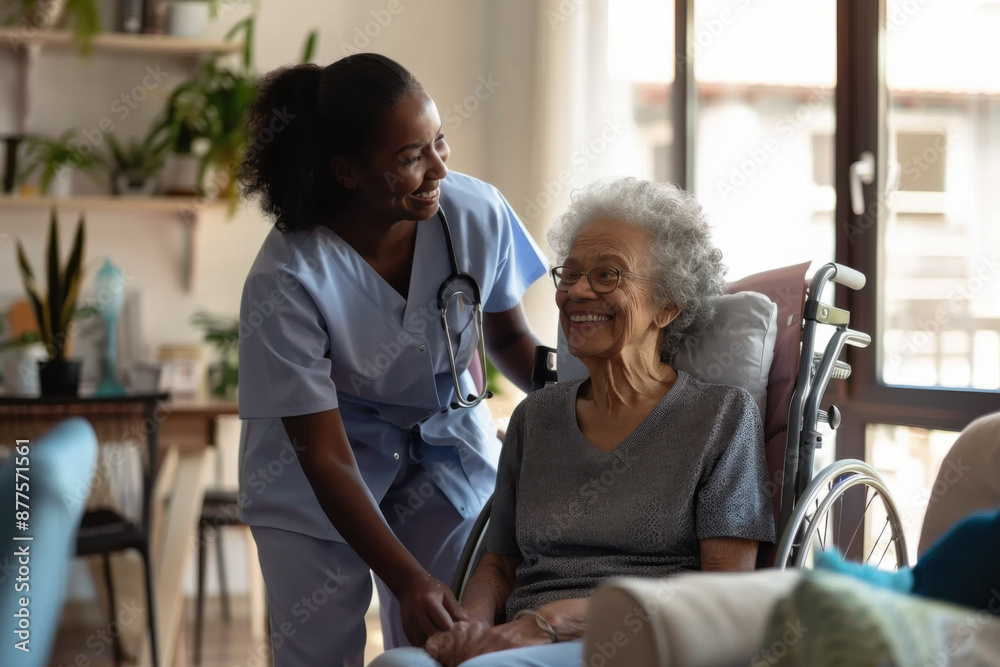 Wall mural smiling young female nurse caregiver assisting senior black woman in a wheelchair at her home