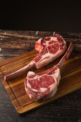 fresh tomahawk beef steak on cutting board