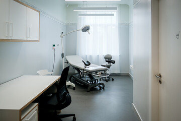 Office of a doctor urologist in a medical clinic with a specialized bed
