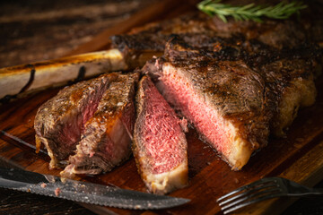 sliced rare grilled tomahawk steak