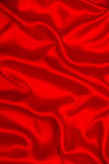 Red silk or satin luxury fabric texture can use as abstract background.