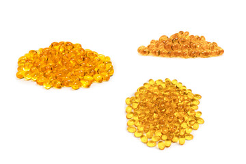 A group of yellow capsules isolated on a white background.