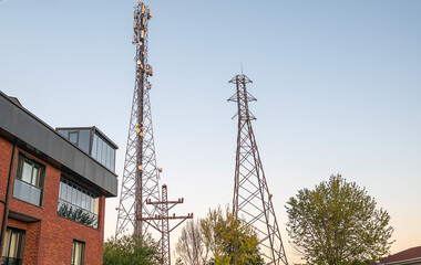 telecommunication towers with radio modules and antennas around the house