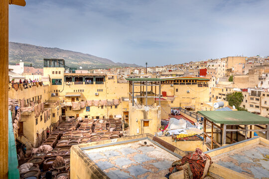 Fez, Morocco - March 18, 2024: The tannery in Fez. The dye industry in the city is considered one of the main tourist attractions. The tanneries are packed with the round stone wells filled with dye
