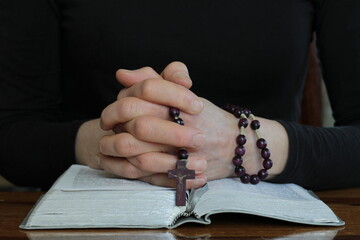 praying and worshiping God on grey black background with people stock image stock photo	