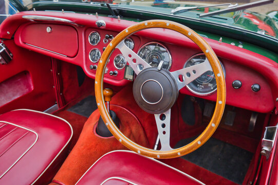 Cologne, Germany, February 6th, 2024 - green Triumph TR 2 Roadster, built between 1952 and 1955. View of the interior, steering wheel, cockpit