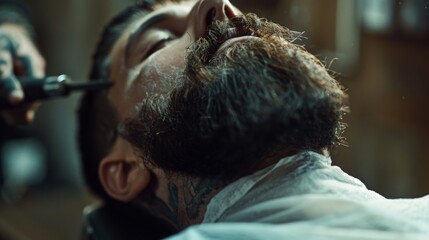A man lies back in a barber's chair as his beard is trimmed. His eyes are closed and he appears to be relaxed.