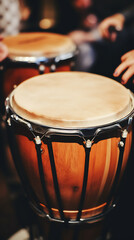 Obraz premium Close-up of a wooden bongo drum with brown, black, and silver tones, capturing the essence of musical rhythm and energy. 