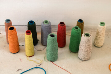 Row of colorful, folded wool fabric samples