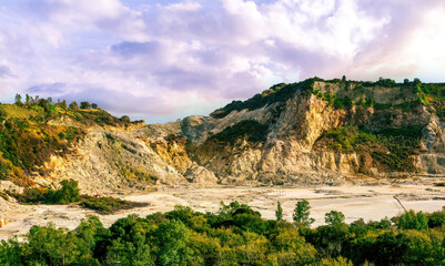 landscape of Plegrean volcano fields in Naples Italy near Pompeii with sulfur yellow caldera duribg eruption of smoke. campi Flegrei and cataclysm of Earthquake