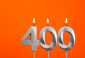 400 candle - Birthday celebration on orange background
