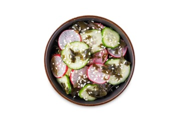 Seaweed radish cucumber salad in a bowl on a white isolated background