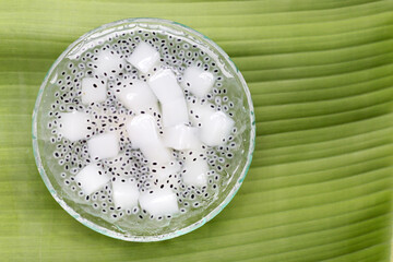 Coconut jelly with basil seeds in syrup