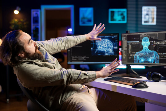 Artificial intelligence entity with anthropomorphic body escaping control of creator, frightening developer pulling back from monitor. AI robot gaining humanoid form, scaring afraid engineer