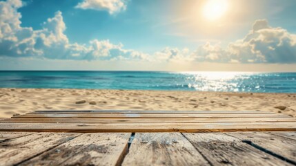 Fototapeta premium A peaceful beach scene with a wooden deck in the foreground, leading to a serene ocean under a bright sky with soft clouds, depicting a tranquil vacation spot.