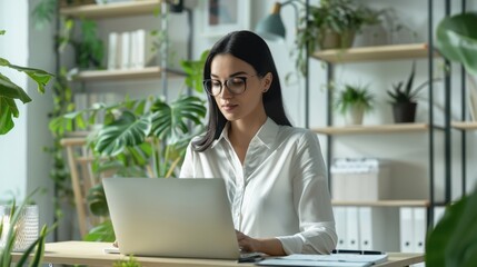Fototapeta premium The woman at office desk