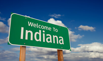 Welcome To Indiana Green Road Sign Over Blue Sky with Some Clouds. © Andy Dean