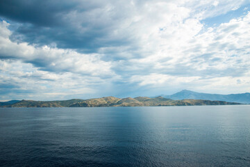 Mountain and sea , view from the ship in Greece  .