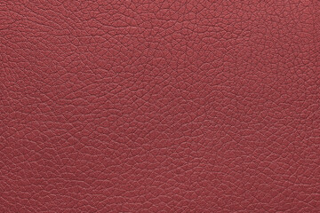 Natural, genuine red leather texture, structure of glossy leatherette macro background