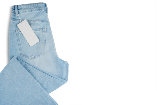 Denim blue jean, folded blue jeans pants with blank label tag, isolated on white, transparent background, top view. Back side of jeans with back pocket, mockup, template, banner, header