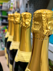 Bottles of Champagne on Grocery Store Shelf