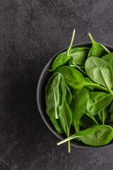 Fresh green spinach leaves in the bowl. Natural vegetarian food.