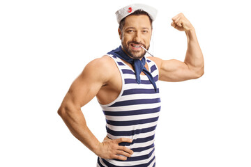 Cheerful sailor in a uniform showing muscles and smoking