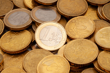 a pile of euro coins