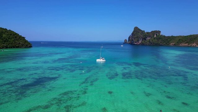 Catamaran sailing in turquoise water Phi island Amazing aerial view flight drone