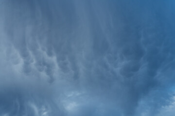 Dark Grey Stormy Sky Mammatus Clouds Texture Pattern Background.