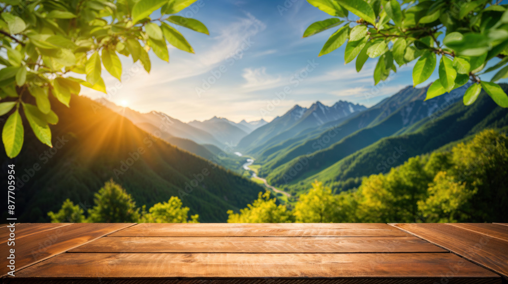 Poster empty wooden table for displaying products with blurred mountain landscape in background at sunset