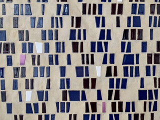 Wall with blue mosaic background. Multi-colored blue mosaic tiles at the wall 