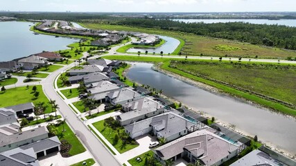 Aerial drone video flying above luxury housing community in Southwest Florida.