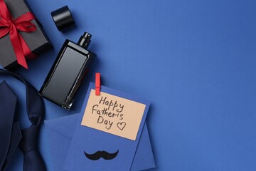 Greeting card with phrase Happy Father's Day, envelope, bottle of perfume, tie and gift on blue...