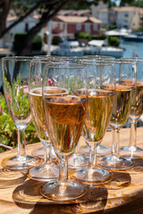 Summer party, French brut rose champagne sparkling wine in flute glasses in yacht harbour of Port Grimaud near Saint-Tropez, French Riviera vacation, Var, France