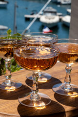 Summer party, French brut rose champagne sparkling wine in coupe glasses in yacht harbour of Port Grimaud near Saint-Tropez, French Riviera vacation, Var, France