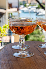 Summer party, French brut rose champagne sparkling wine in coupe glasses in yacht harbour of Port Grimaud near Saint-Tropez, French Riviera vacation, Var, France