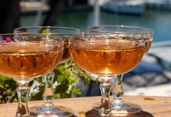 Summer party, French brut rose champagne sparkling wine in coupe glasses in yacht harbour of Port Grimaud near Saint-Tropez, French Riviera vacation, Var, France