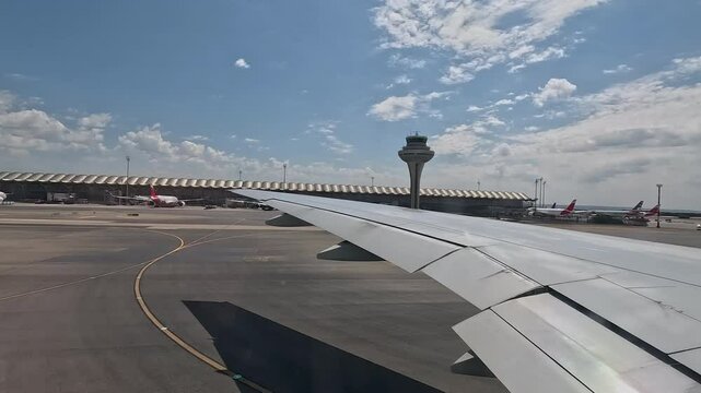 MADRID, SPAIN - 4 JUN 2024:  Madrid Spain international airport control tower runway. Vacation and business travel departure. Pilot takes passengers airborne. Transportation from Europe. Runway.