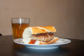 sandwich with burger ketchup and soft drink