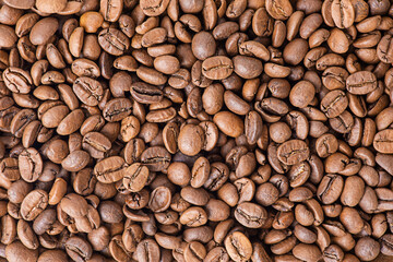 Roasted coffee beans as a background. Coffee has many beans